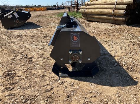 wolverine skid steer attachment dealers